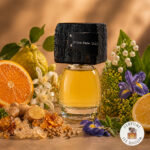 The original bottle of Notre Dame 15.4.2019 Olfattivo with a visualization of the fragrance notes: "Frankincense, Sweet Orange, Galbanum, Coriander, Lemon, Iris, Basil, Ginger, Bergamot, Neroli.