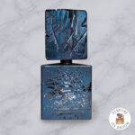 Scusami by Filippo Sorcinelli perfume decant on a marble background with Lexbloom store logo.